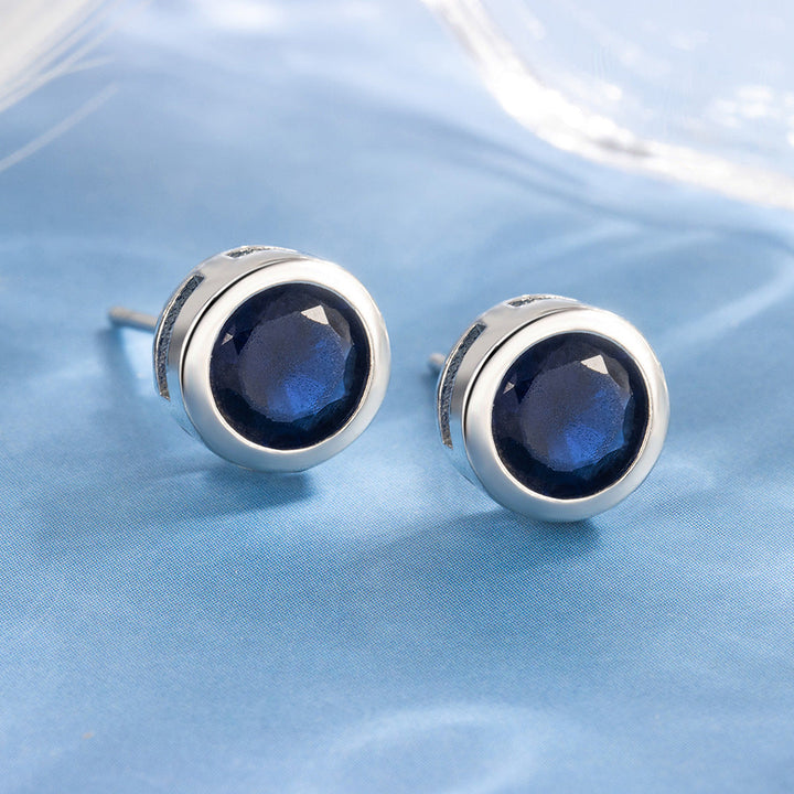 Puces d'oreilles serties de saphir | Or blanc