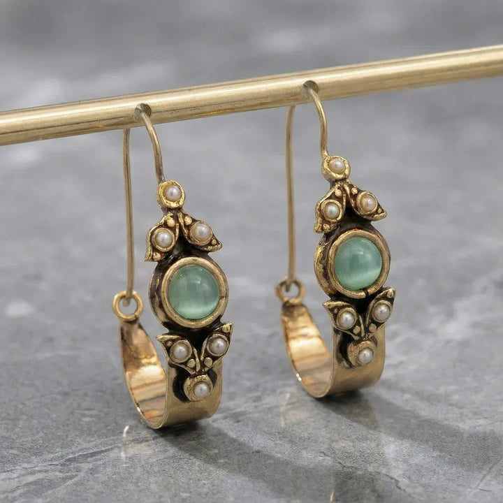 Boucles d'oreilles au style ethno-rétro avec pendentif | Or