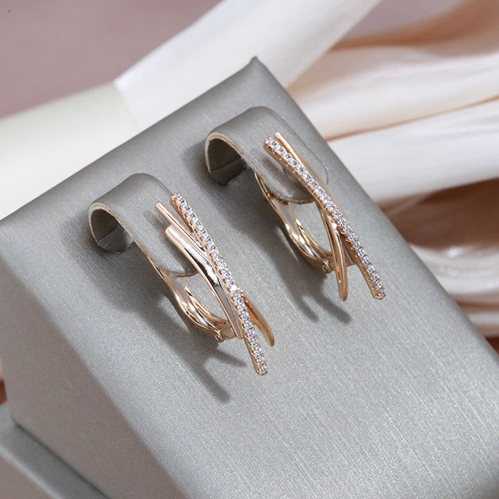 Boucles d'oreilles croisées élégantes dorées | Or