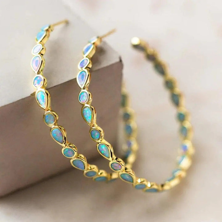 Boucles d'oreilles rétro avec opale bleue | Or