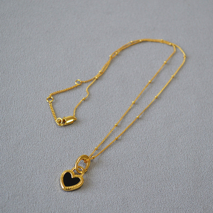 Collier avec pendentif en noir et blanc cœur | Or