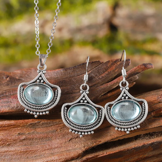 Collier rétro et boucles d'oreilles avec des pierres précieuses ovales bleues | Or